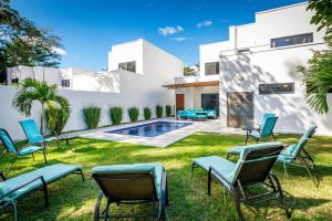 Ultramodern Townhome with an Inviting Coastal Design and Lush Outdoor Oasis with a Private Pool