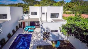 Ultramodern Townhome with an Inviting Coastal Design and Lush Outdoor Oasis with a Private Pool