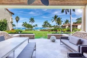 Modern Oceanfront Condo with a Chic Coastal Design, Resort-Style Amenities, and Direct Beach Access