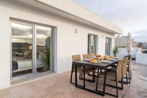 Bright Beachside Flat with Terrace by HostWise