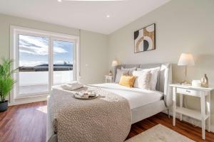 Bright Beachside Flat with Terrace by HostWise