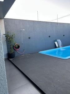 Espaço aconchegante com piscina e area gourmet