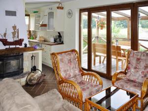 Holiday Home by Lake Rosnowskie with Boat