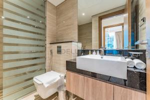Balcony Facing a Partial Canal View, Close to Metro and Marine Transport, Downtown Attractions Just a Ride Away, Urban Oasis, Business Bay by Deluxe Holiday Homes