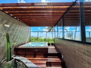 Lindo apto Pé na areia com Jacuzzi privativa