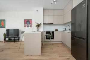 Beige Apartment in Wrocław with Parking and Balcony by Noclegi Renters