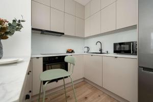 Beige Apartment in Wrocław with Parking and Balcony by Noclegi Renters