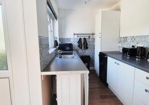 Cosy 2BR House on Quiet Street with Free Parking