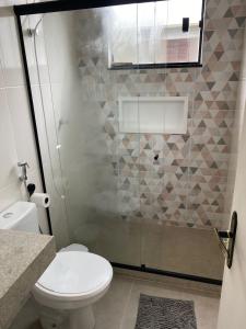 Suíte privativa aconchego a alguns passos da praia