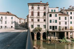 Palladio Apartment - In Centro con Garage, Vista Fiume, Jacuzzi