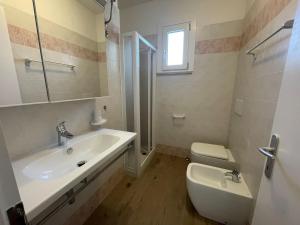 Sunny family apartment steps from the beach