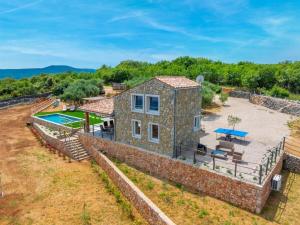 Holiday home in Risika with swimming pool