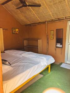 Maati- The Riverside Mud-house Stay