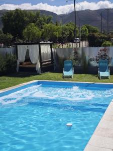 Suites Amplias y Comfortables - Con Balcon, Parquizado, Asador y Pileta