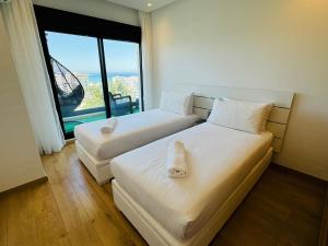 Sunlit 2-Bedroom Apartment with a Pool & Sea Views