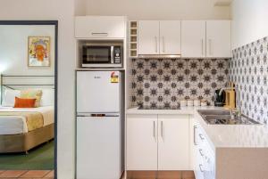 2BR Ground-Floor Gem, Walk to Everything, 2 Pools