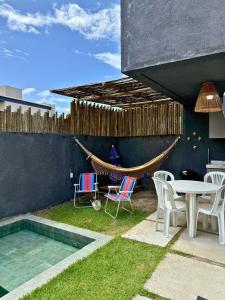 MHV Milagres - Studio Guadalupe 05, quarto e sala privativo a poucos metros da Praia do Marceneiro