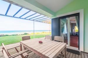 Moradia Milú frente à praia