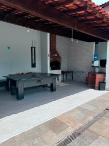 Casa na praia de Bertioga com Pscina e Churrasqueira - até 10 Pessoas