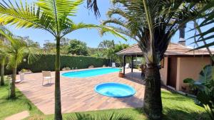 Casa Paraíso com piscinas e espaço gourmet