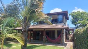 Casa Paraíso com piscinas e espaço gourmet
