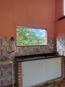 Casa com piscina no centro da serra do cipó