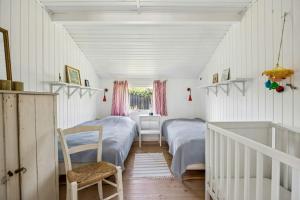 Traditional Black And White House Near Dråby Beach