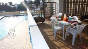 Beachfront colourful flat with swimming pool