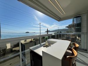 Frente Mar Sonho de Palmas 101 - Lindo Apto decorado na Praia de Palmas