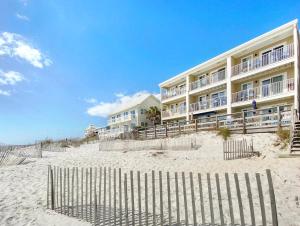 Leeward II 3 l Beachfront Condo l Large first level deck with steps down to sand