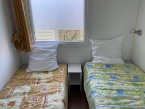 Mobil-home 29m², 2 chambres, terrasse, jardin - API-1-52-1108