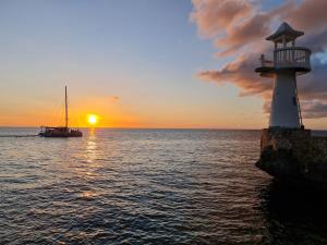Negril Huts Enchantment - Cottages in trees with AC, ocean views, pool, Sea access