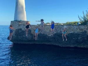 Negril Huts Enchantment - Cottages in trees with AC, ocean views, pool, Sea access