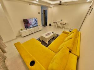 Chic 2 BHK with Balcony & Bold Yellow Lounge Powai