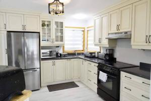Modern 4BR Lake Escape with Patio & BBQ Area