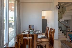 ELIVAAS White House 4-BHK Villa with Panoramic Hill Views, Glass Room, Outdoor Pool & Dam nearby