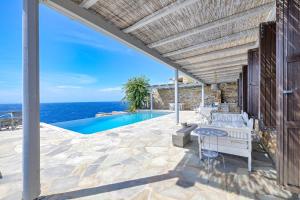 Waterfront villa "Afros" with a pool, direct access to the sea and a small beach