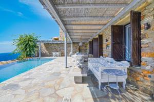 Waterfront villa "Afros" with a pool, direct access to the sea and a small beach