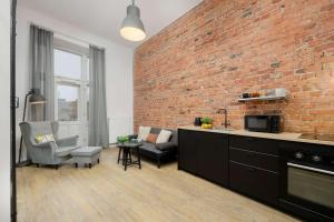 Stylish Apartment with Mezzanine, next to Metro Station by Noclegi Renters