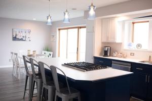 Cast away with kayaks a game room a fire pit and views