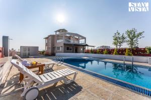 StayVista at Golden Petal with BBQ & Bonfire