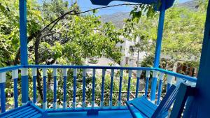 House with Blue Balcony
