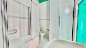 House with Blue Balcony