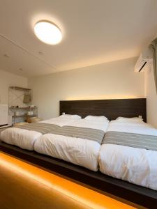 ISSHUKU NOMA池袋II 303 - Quad Room