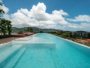 Melia 2BR with Rooftop Pool - Skypark Laguna by TropicLook