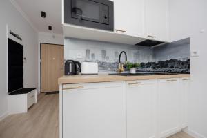 Air Conditioned Studio in Warsaw with Balcony by Noclegi Renters