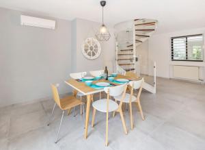 Private Garden Duplex in Voula by GHH