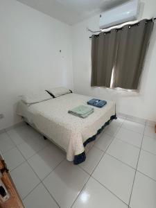 Quarto privativo em ambiente compartilhado com ar condicionado