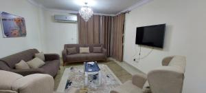 Fully finished 3-bedroom, 3-bathroom apartment with garden view in Jana Compound, Sheikh Zayed near Hyperone