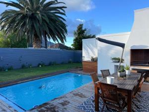 Modern & Secure 3-Bed Home with Pool & Garden